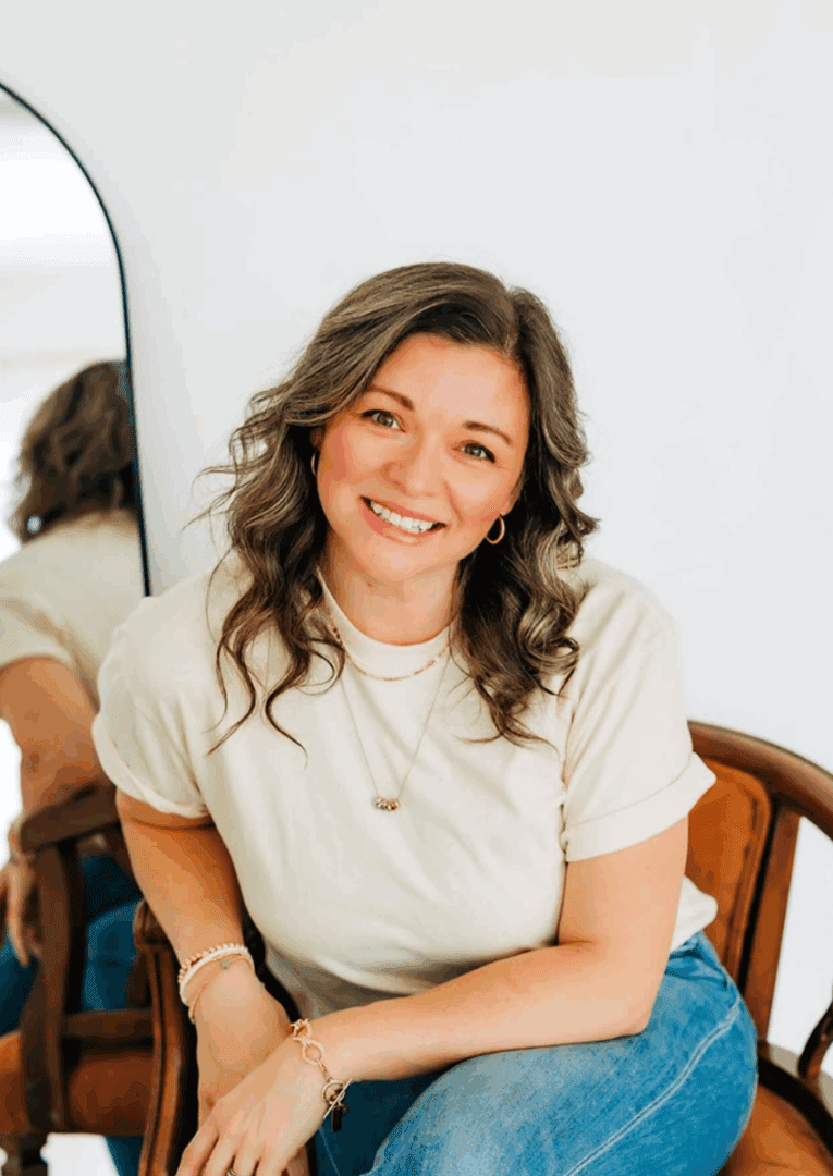 Relaxed woman posing indoors with mirror reflection