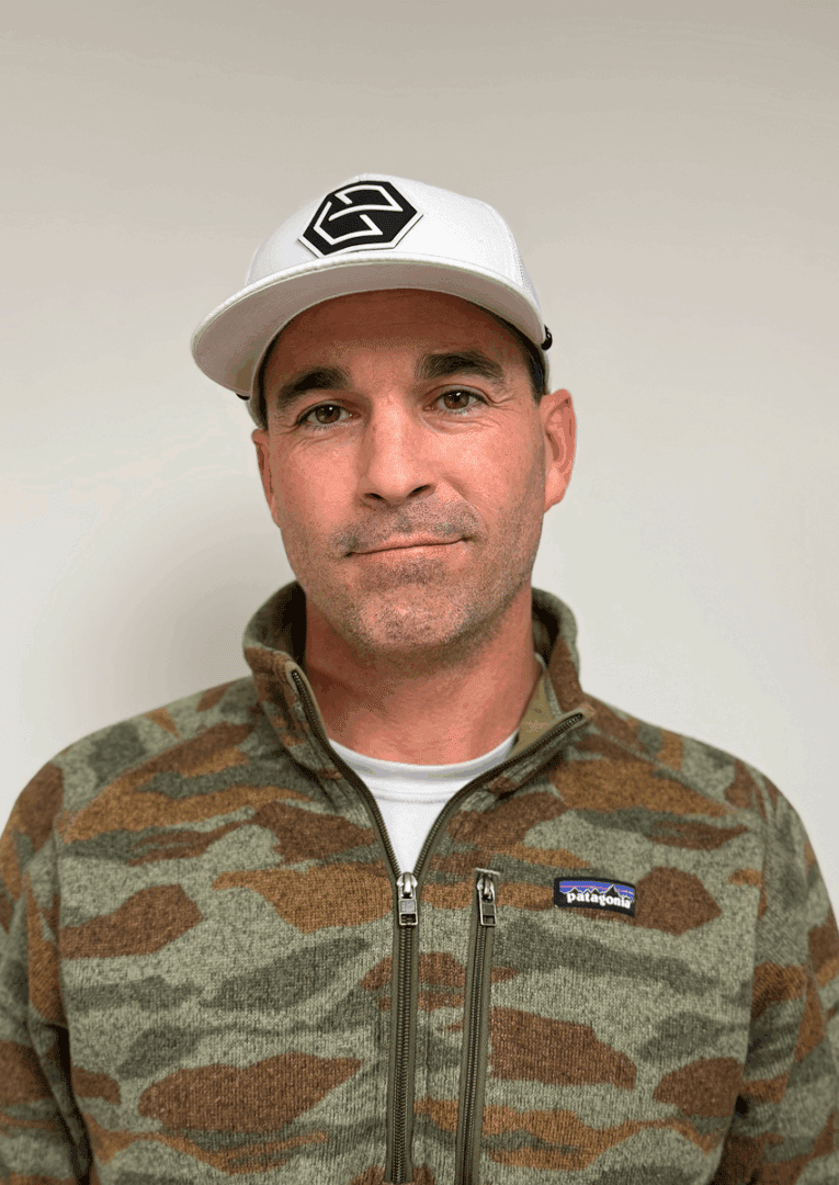 Man in camo jacket and white cap