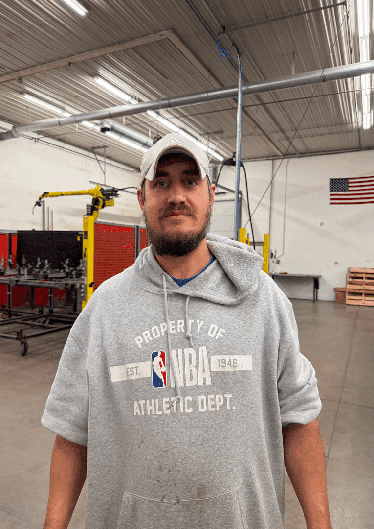 Person wearing cap in industrial setting