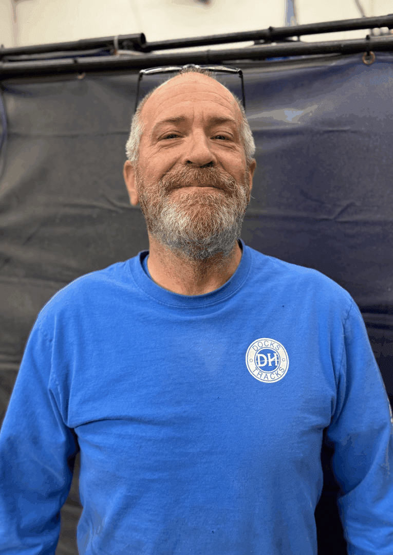 Man standing in front of dark background