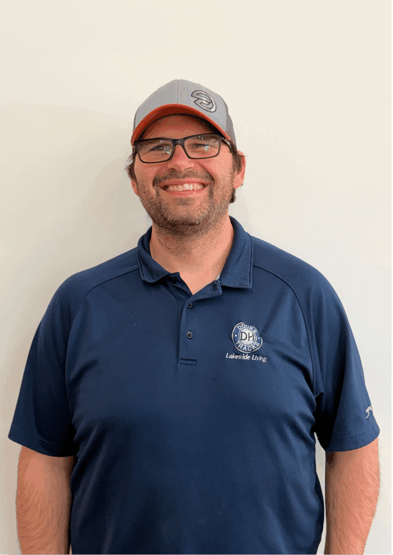 Smiling man in blue polo shirt