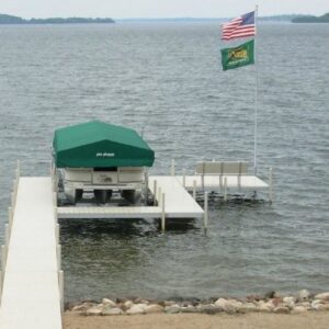 Pier with boat lift and two flags