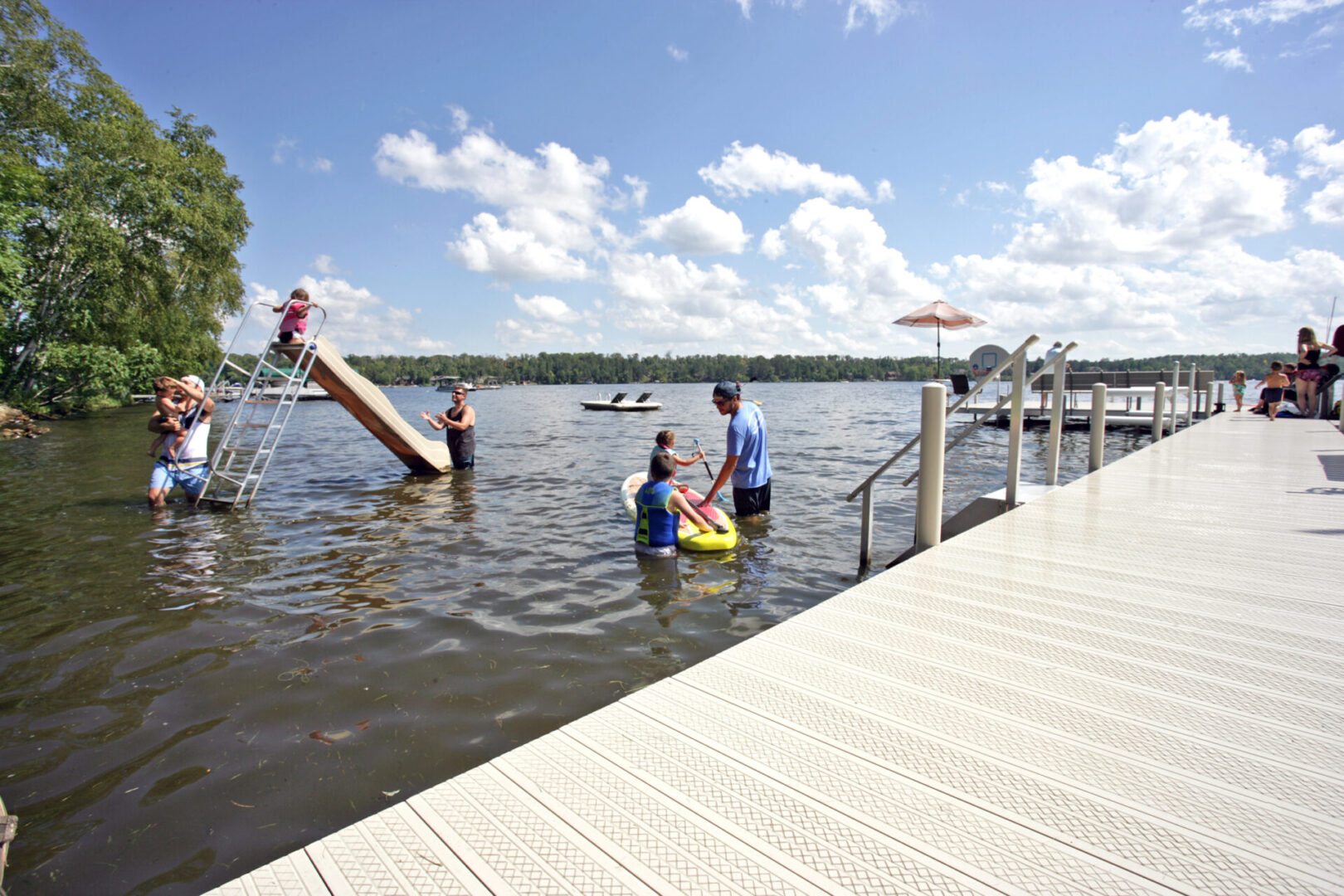 Family playing in lake water