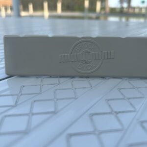 Small screw next to plastic block